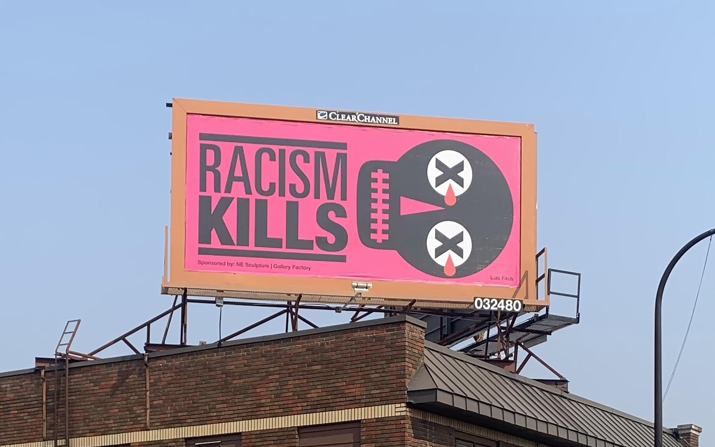 Billboard saying Racism kills depicting a skull crying blood at George Floyd square in Minneapolis. by Luis Fitch